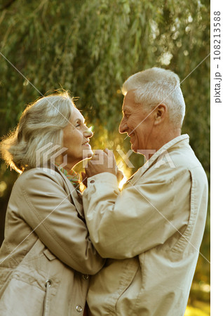 Elderly couple dance in the park in autumn. 108213588