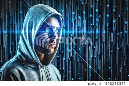 Hacker in hoodie in dark background  108218555