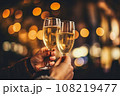 Friends celebrating and champagne glasses with gold bokeh blur background, Generative AI. 108219477