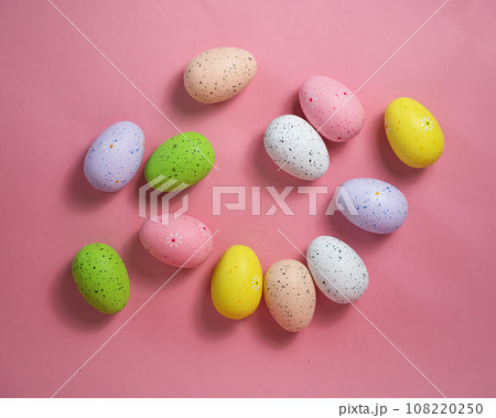 Painted quail eggs on a pink background. Easter decorations. Painted quail eggs on a pink background. Easter decorations. 108220250