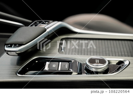 Close-up of an automatic transmission of a modern car. Close-up of an automatic transmission of a modern car. 108220564