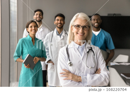 Happy elder mature head doctor woman posing with arms crossed Happy elder mature head doctor woman posing with arms crossed 108220704