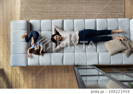 Top view happy Asian mother and son relaxing on sofa Top view happy Asian mother and son relaxing on sofa 108221458