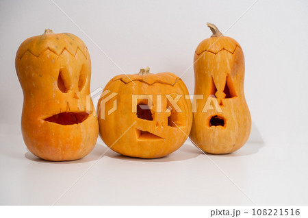 Three jack-o-lantern on a white background. Halloween decoration. 108221516