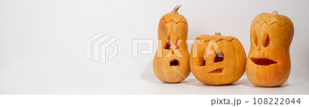 Three jack-o-lantern on a white background. Halloween decoration. Widescreen. Three jack-o-lantern on a white background. Halloween decoration. Widescreen. 108222044
