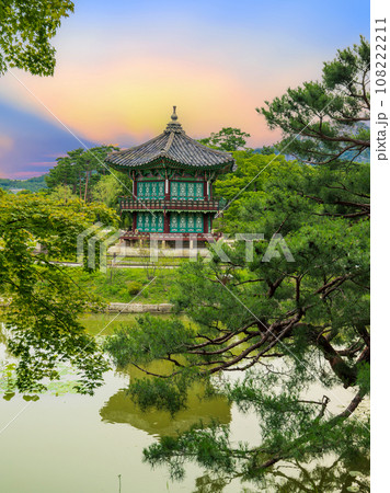 Sunset at the Hyangwonjeong Pavilion in the center of the pond in the Gyeongbokgung palace Sunset at the Hyangwonjeong Pavilion in the center of the pond in the Gyeongbokgung palace 108222211