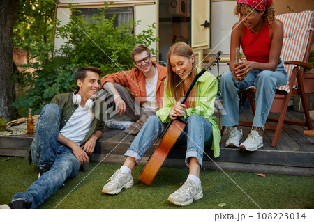 Summer party camping of diverse friends group with guitar music Summer party camping of diverse friends group with guitar music 108223014