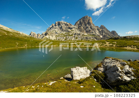 Clear emerald-turquoise pond water in Laghi dei piani area Clear emerald-turquoise pond water in Laghi dei piani area 108223325