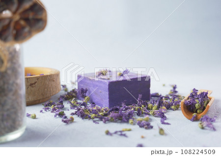 Homemade natural soap bar and lavender flower on table  108224509
