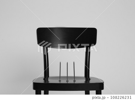 Chair with iron nails isolated on white. Hemorrhoids concept 108226231