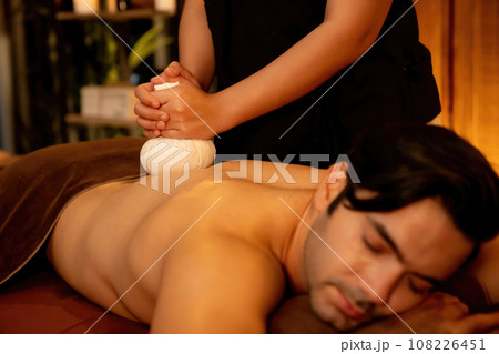 Hot herbal ball spa massage body treatment. Quiescent 108226451