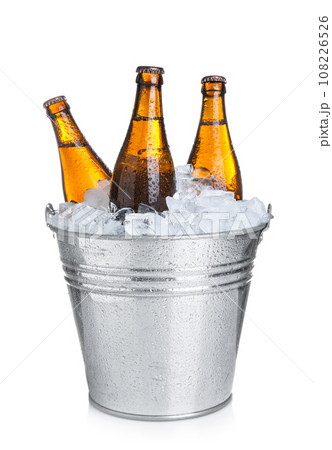 Beer in metal bucket with ice isolated on white 108226526