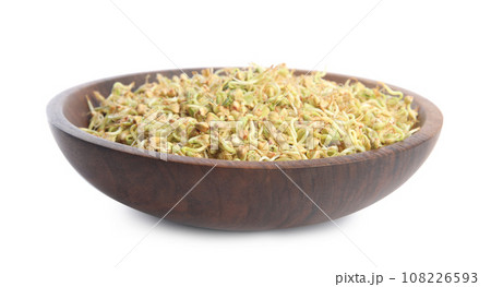 Wooden plate of sprouted green buckwheat isolated on white 108226593