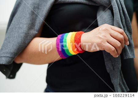 Asian woman with rainbow flag, LGBT symbol rights and gender equality, LGBT Pride Month in June. 108229114