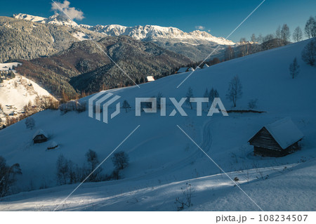 Winter landscape with snow covered slopes and high mountains 108234507