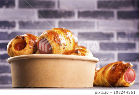 An uncooked sausage bread roll or hotdog bun dough An uncooked sausage bread roll or hotdog bun dough 108244561