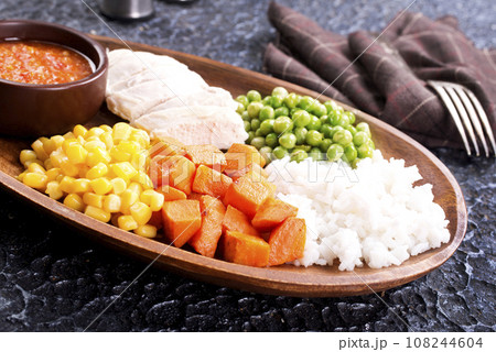 lunch box with rice, carrot, corn and chicken meat 108244604