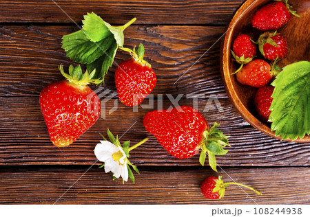 Fresh ripe organic strawberry on wooden table Fresh ripe organic strawberry on wooden table 108244938