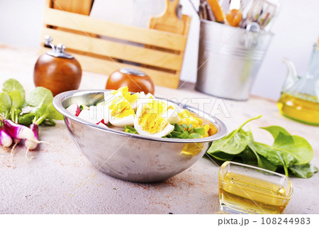 Bowl of vegetarian salad with boiled eggs- radishes- cucumbers- corn salad Bowl of vegetarian salad with boiled eggs- radishes- cucumbers- corn salad 108244983