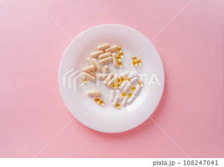 Weight Loss Pills and Measuring Tape, Diet Supplements Capsules, Obesity Lose Tablets, Color Drugs Pile Weight Loss Pills and Measuring Tape, Diet Supplements Capsules, Obesity Lose Tablets, Color Drugs Pile 108247041