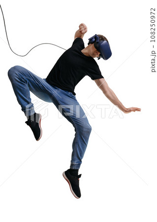 Excited young man in 3d goggles playing VR game and finding himself as fighter. 108250972