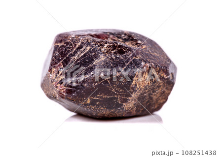 Macro of a mineral garnet stone on a white background 108251438