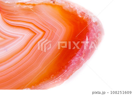 Macro mineral orange agate in crystals on white background Macro mineral orange agate in crystals on white background 108251609