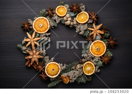 Christmas composition. Wreath made of spices and dry oranges Flat lay, top view, copy space Christmas composition. Wreath made of spices and dry oranges Flat lay, top view, copy space 108253020