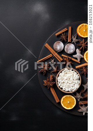 Christmas composition. Wreath made of spices and dry oranges Flat lay, top view, copy space Christmas composition. Wreath made of spices and dry oranges Flat lay, top view, copy space 108253021