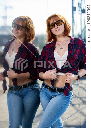 Close-up Portrait of Stylish Redhead Woman in Urban Autumn Fashion Close-up Portrait of Stylish Redhead Woman in Urban Autumn Fashion 108253397