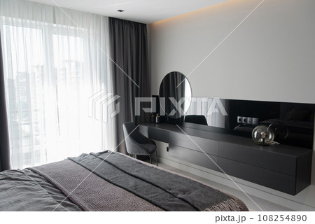 Vanity table for women make-up in modern grey bedroom in luxury apartment. Vanity table for women make-up in modern grey bedroom in luxury apartment. 108254890