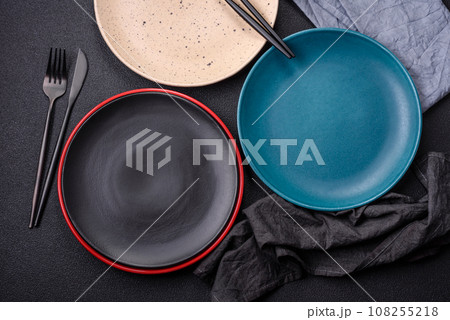 Beautiful empty round ceramic plate on a concrete background 108255218