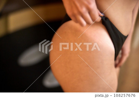 Tan Results, Tan Session, Bronzing Process. In no time, woman receives bronzed look using state-of-the-art tanning equipment. 108257676