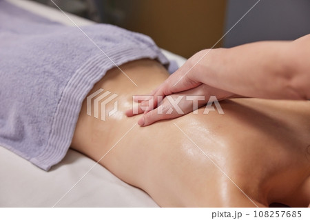 Relaxing Experience, Body Relaxation, Relaxing Oils. Aromatic oils are enhancing woman's massage experience at this prestigious beauty spa. Relaxing Experience, Body Relaxation, Relaxing Oils. Aromatic oils are enhancing woman's massage experience at this prestigious beauty spa. 108257685