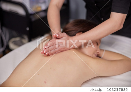 Aromatic Massage, Aroma Therapy, Aromatic Oils. Female client is enjoying aromatic massage with use essential oils at beauty spa. Aromatic Massage, Aroma Therapy, Aromatic Oils. Female client is enjoying aromatic massage with use essential oils at beauty spa. 108257686