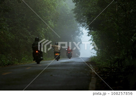 group of biker riding on foggy mountain road at khaoyai national park one of most popular traveling destination in thailand group of biker riding on foggy mountain road at khaoyai national park one of most popular traveling destination in thailand 108257856