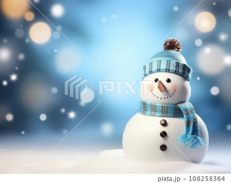 Close-up of a cute toy snowman in a blue hat and scarf on a snowy background on a blurred bokeh background in winter Christmas scenery with copy space. Happy New Year's attributes, greeting card. 108258364