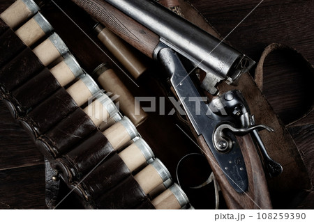 12-gauge break-action smooth-bored shotgun with paper cases. 108259390