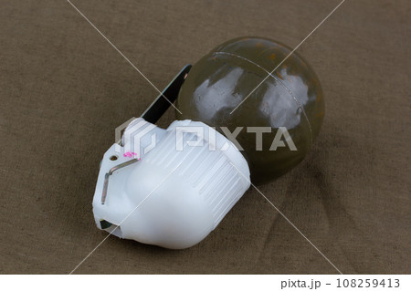 Soviet hand grenade RGN on khaki canvas Soviet hand grenade RGN on khaki canvas 108259413