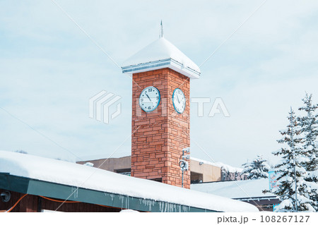 Clock tower with snow at Asahiyama Zoo in winter season. landmark and popular for tourists attractions in Asahikawa, Hokkaido, Japan. Travel and Vacation concept 108267127