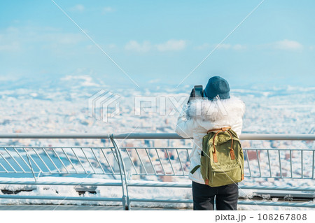 Woman tourist Visiting in Hakodate, Traveler in Sweater sightseeing view from Hakodate mountain with Snow in winter. landmark and popular for attractions in Hokkaido, Japan.Travel and Vacation concept Woman tourist Visiting in Hakodate, Traveler in Sweater sightseeing view from Hakodate mountain with Snow in winter. landmark and popular for attractions in Hokkaido, Japan.Travel and Vacation concept 108267808
