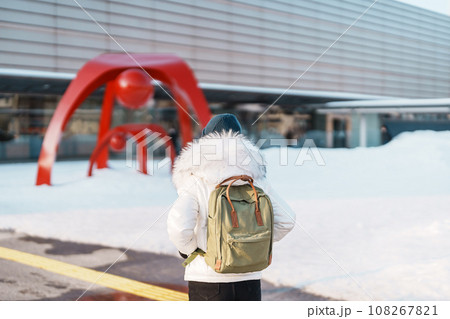Woman tourist Visiting in Hakodate, Traveler in Sweater sightseeing Hakodate Train Station with Snow in winter. landmark and popular for attractions in Hokkaido,Japan.Travel and Vacation concept Woman tourist Visiting in Hakodate, Traveler in Sweater sightseeing Hakodate Train Station with Snow in winter. landmark and popular for attractions in Hokkaido,Japan.Travel and Vacation concept 108267821