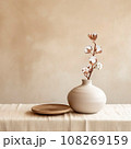 Beige ceramic vases with dry cotton branches. Stylish and minimalistic background for display your products in living room. Scandinavian interior. Modern home decor. Copy space. 108269159