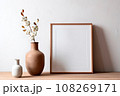 Frame and poster mock up in living room with coton branch in clay vase. Scandinavian interior. 108269171