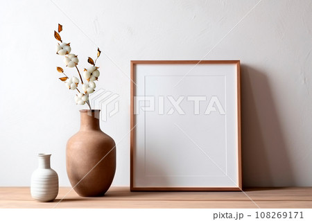 Frame and poster mock up in living room with coton branch in clay vase. Scandinavian interior. Frame and poster mock up in living room with coton branch in clay vase. Scandinavian interior. 108269171