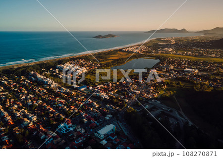 Coastline with ocean and town with sunset tones in Campeche, Florianopolis 108270871