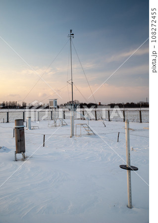 Weather station in the evening during sunset in winter. A device at a weather station for recording 108272455