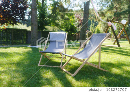 Garden loungers in the garden, in the shade under the trees. Outdoor garden furniture. 108272707