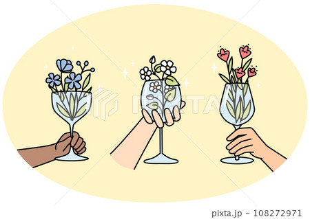 Hands of multiracial people holds wineglasses with flowers. 108272971