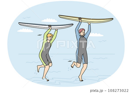 Guys in wetsuits run with surfboards along seashore. 108273022